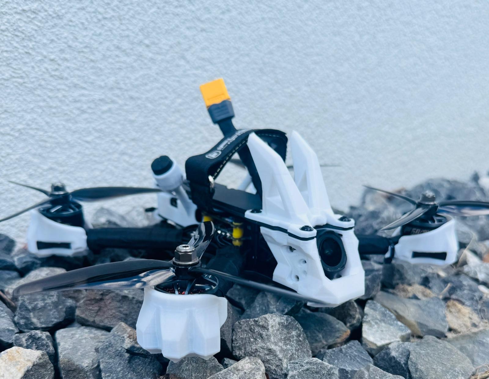 Shreddo 5 FPV frame on rocks