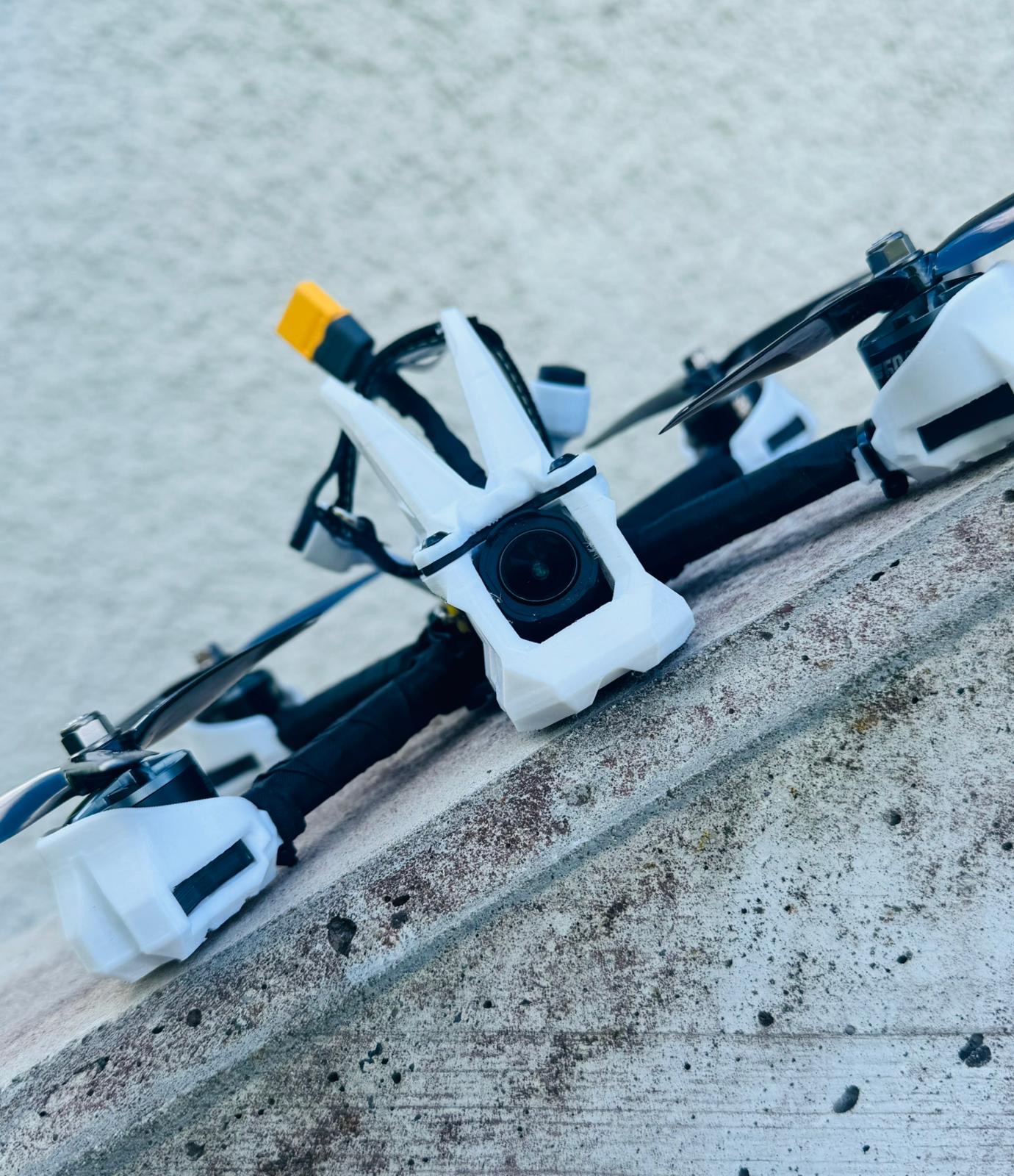Front camera cage view of the Shreddo 5 FPV frame on concrete
